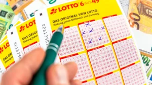 5-february-2024-a-person-fills-out-a-lotto-6-aus-49-ticket-and-ticks-the-winning-numbers-photomontag.webp
