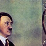 Adolf-Hitler-speaks-on-radio-in-Berlin-circa-1934.jpg