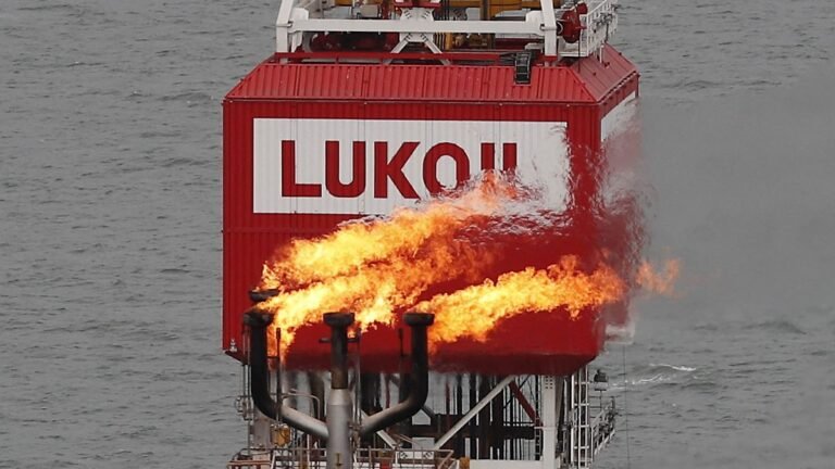 FILE-PHOTO-A-gas-torch-is-seen-next-to-the-Lukoil-company-sign-at-the-Filanovskogo-oil-platform-in-t.jpeg