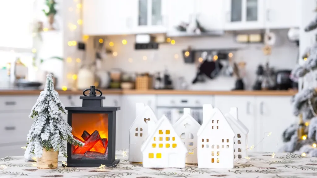 cozy-christmas-decor-tiny-house-of-small-size-on-table-of-festive-white-modern-kitchen-gift-for-new.webp