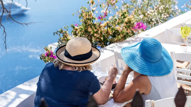 santorini-greece-20-september-2023-two-ladies-in-a-restaurant-on-santorini-in-greece-during-nice-wea.webp