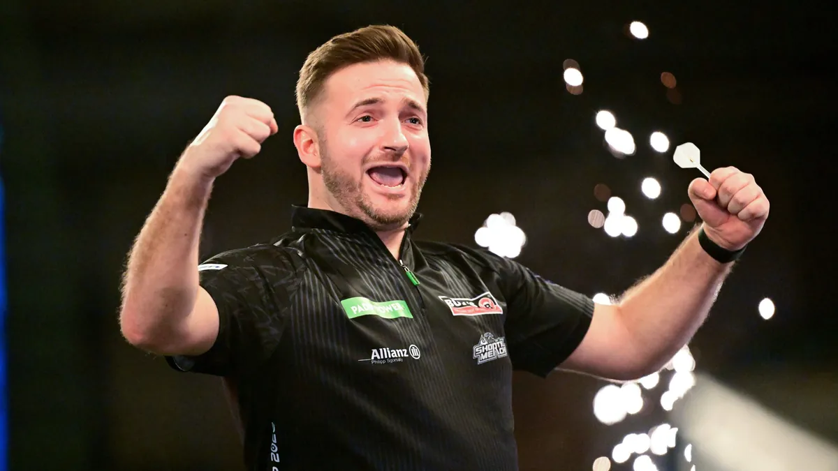 11-12-2025-2025-26-world-darts-championship-arno-merk-celebrates-victory-during-the-2025-26-paddy-po.webp