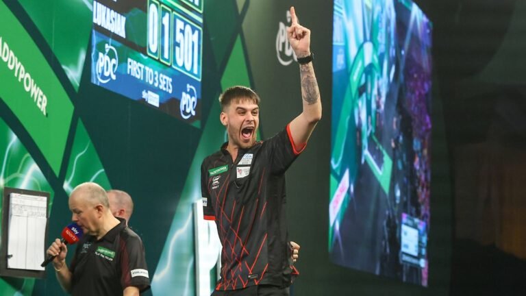 14-12-2025-2025-26-World-Darts-Championship-Dom-Taylor-hits-a-double-and-celebrates-during-the-2025.jpeg