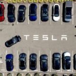 FILE-Tesla-vehicles-line-a-parking-area-at-the-company-s-Fremont-Calif-factory-Aug-5-2025.jpg