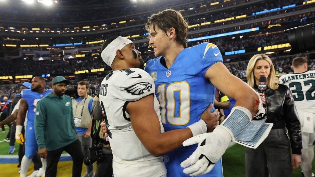 Los-Angeles-Chargers-quarterback-Justin-Herbert-10-hugs-Philadelphia-Eagles-quarterback-Jalen-Hurts.jpeg