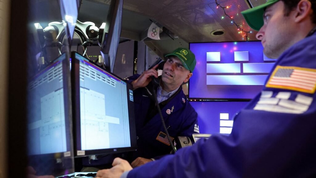 Traders-work-on-the-floor-at-the-New-York-Stock-Exchange-NYSE-in-New-York-City-U-S-December-8-2025.j.jpeg