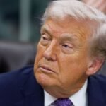 U-S-President-Donald-Trump-looks-on-as-he-signs-an-executive-order-on-AI-in-the-Oval-Office-at-the-W.jpeg