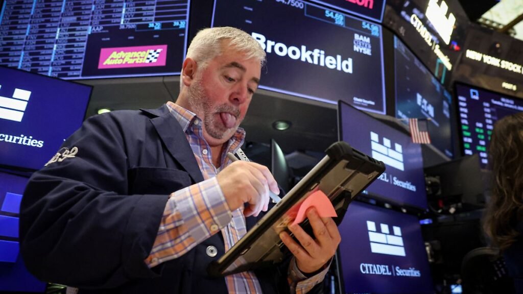 1768604945_Traders-work-on-the-floor-at-the-New-York-Stock-Exchange-NYSE-in-New-York-City-U-S-January-6-2026.jp_.jpeg