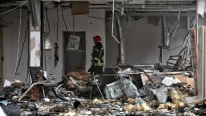 A-firefighter-works-at-a-car-dealership-damaged-by-a-Russian-drone-attack-Odesa-Ukraine-February-13.jpeg