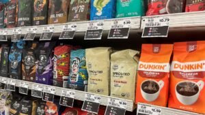 Coffee-packages-with-their-price-tags-are-on-display-on-a-shelf-at-a-supermarket-in-Union-City-New-J.jpeg