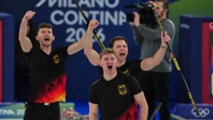 Germany-s-Johannes-Scheuerl-Marc-Muskatewitz-and-Benjamin-Kapp-react-after-the-men-s-curling-round-r.jpeg