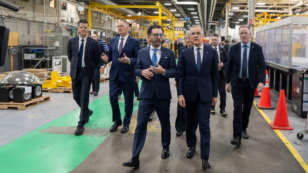 Prime-Minister-Mark-Carney-foreground-right-and-CAE-Inc-president-and-CEO-Matthew-Bromberg-tour-comp.jpeg