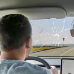 bavaria-germany-march-9-2025-photomontage-a-driver-looks-through-a-cracked-or-broken-windshield-caus.webp