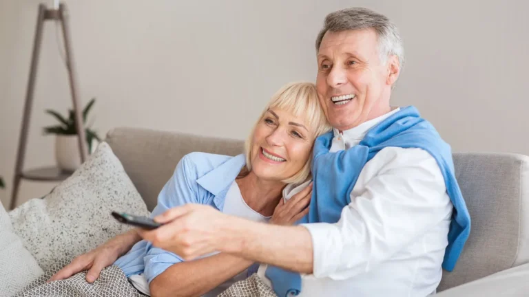 relaxed-senior-couple-watching-television-at-home-relaxed-senior-couple-watching-television-sitting.webp