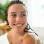 relaxed-young-woman-enjoying-self-care-and-hair-wash-in-bathtub-relaxed-young-woman-enjoying-self-ca.webp