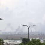 260319-HAIFA-March-19-2026-Xinhua-This-photo-released-by-Israeli-media-shows-smoke-rising-from-oil-r.jpeg