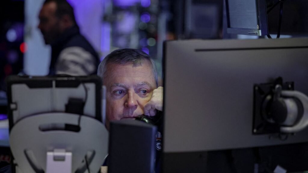 A-trader-works-on-the-floor-at-the-New-York-Stock-Exchange-NYSE-in-New-York-City-U-S-March-24-2026.j.jpeg