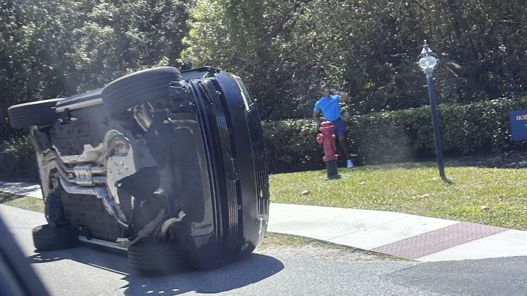Golfer-Tiger-Woods-stands-by-his-overturned-vehicle-in-Jupiter-Island-Fla-on-Friday-March-27-2026.jp_.jpeg