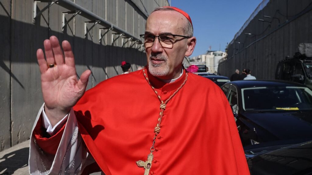 Latin-Patriarch-of-Jerusalem-Cardinal-Pierbattista-Pizzaballa-waves-as-he-crosses-Israel-s-checkpoin.jpeg