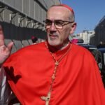 Latin-Patriarch-of-Jerusalem-Cardinal-Pierbattista-Pizzaballa-waves-as-he-crosses-Israel-s-checkpoin.jpeg