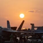 March-6-2026-Undisclosed-Location-United-States-The-sunsets-over-U-S-Navy-F-A-18-fighter-aircraft-st.jpeg
