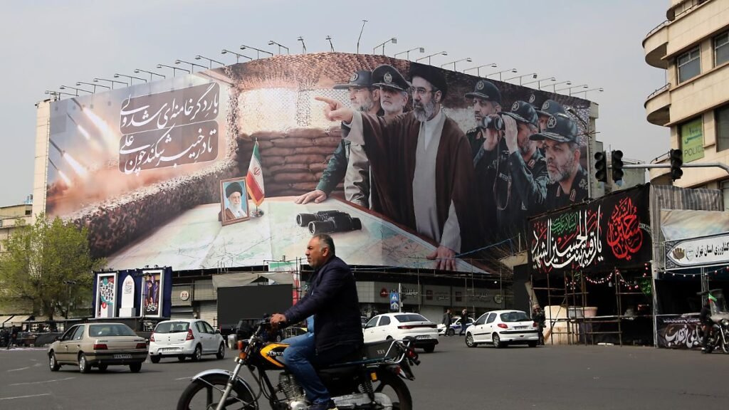 TEHRAN-IRAN-MARCH-14-A-view-of-a-banner-featuring-IranAeos-new-Supreme-Leader-Mojtaba-Khamenei-and-s.jpeg