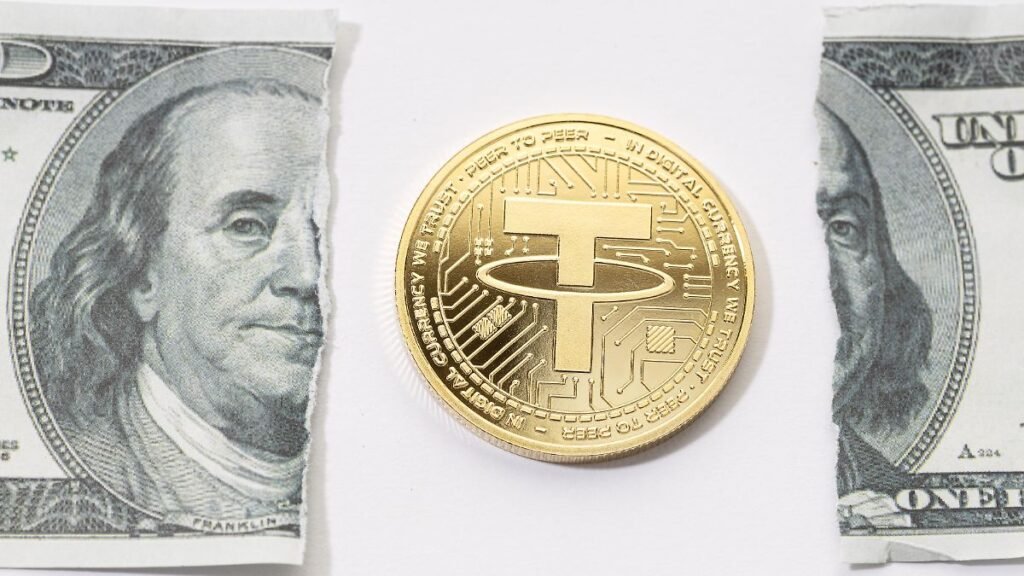 Tether-USDT-coin-and-ripped-dollar-bill.jpg