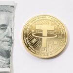 Tether-USDT-coin-and-ripped-dollar-bill.jpg