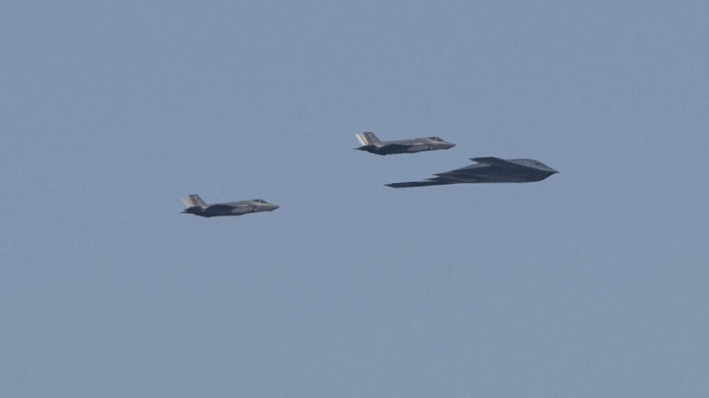 WASHINGTON-D-C-UNITED-STATES-JULY-4-A-B-2-Spirit-stealth-bomber-escorted-by-two-F-22-fighter-jets-of.jpeg