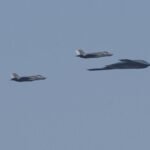 WASHINGTON-D-C-UNITED-STATES-JULY-4-A-B-2-Spirit-stealth-bomber-escorted-by-two-F-22-fighter-jets-of.jpeg
