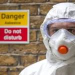 asbestos-protection-model-released-asbestos-protection-worker-wearing-protective-clothing-a-face-mas.webp