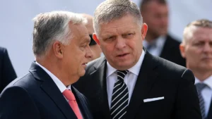 hungarys-prime-minister-viktor-orban-left-and-his-slovakian-counterpart-robert-fico-talk-to-each-oth.webp