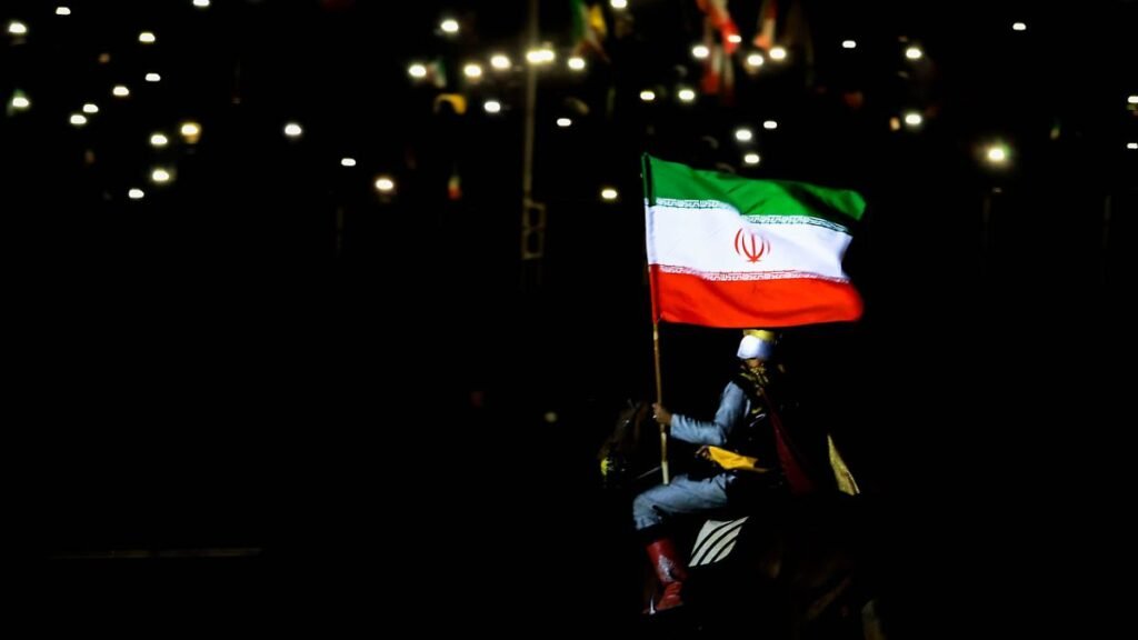 April-14-2026-Iran-Iran-Pro-government-supporters-wave-national-flags-during-a-state-organised-rally.jpeg
