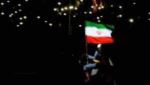 April-14-2026-Iran-Iran-Pro-government-supporters-wave-national-flags-during-a-state-organised-rally.jpeg