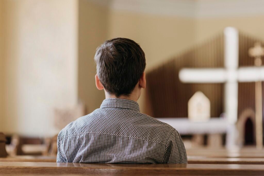 back-view-boy-praying-church-1-scaled.jpg