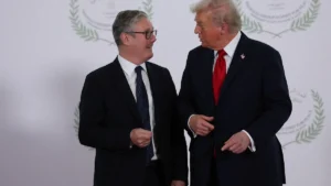president-donald-trump-and-british-prime-minister-keir-starmer-speak-as-they-pose-for-a-photo-in-sha.webp