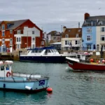 seasonal-weather-boats-in-the-harbour-on-a-dull-day-by-the-sea-credit-geoffrey-swaine-avalon-uk-dors.webp