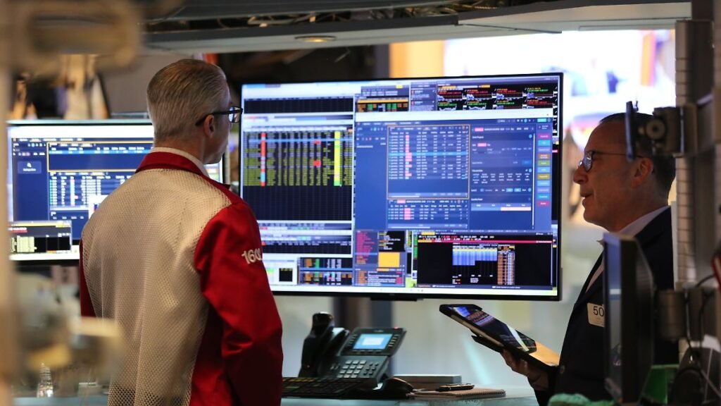 260427-NEW-YORK-April-27-2026-Xinhua-Traders-talk-to-each-other-on-the-trading-floor-of-the-New-York.jpeg