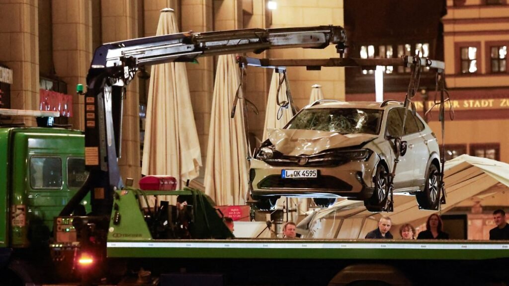 A-car-which-drove-into-a-group-of-people-is-lifted-at-the-scene-of-a-deadly-incident-in-Leipzig-Germ.jpeg