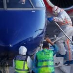A-person-boards-a-plane-flying-to-the-Netherlands-which-is-transporting-passengers-from-the-cruise-s.jpeg