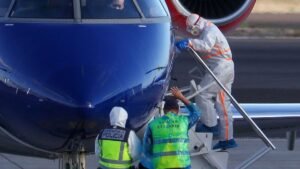 A-person-boards-a-plane-flying-to-the-Netherlands-which-is-transporting-passengers-from-the-cruise-s.jpeg