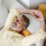 Mature-person-relaxing-and-daydreaming-on-sofa-at-home-indoors-model-released-Symbolfoto-property-re.jpeg