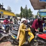 People-queue-to-fill-petrol-in-their-two-wheelers-at-a-fuel-station-in-Nagaon-District-Assam-India-o.jpeg