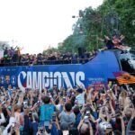 Surrounded-by-supporters-FC-Barcelona-players-celebrate-atop-a-bus-after-winning-the-Spanish-La-Liga.jpeg