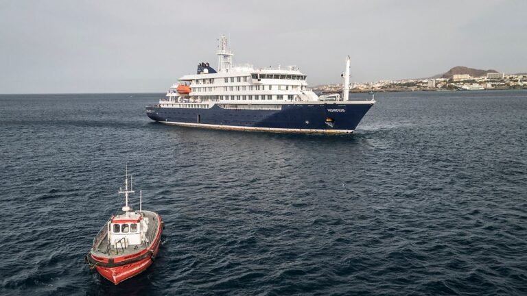 This-aerial-view-shows-a-boat-heading-towards-the-port-from-the-cruise-ship-MV-Hondius-stationary-of.jpeg