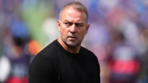 barcelonas-head-coach-hansi-flick-enters-to-the-pitch-prior-to-the-spanish-la-liga-soccer-match-betw.webp