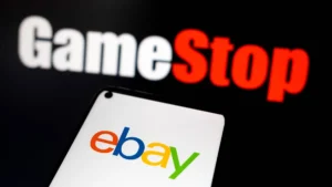 gamestop-makes-bold-56-billion-play-for-ebay-the-ebay-logo-appears-on-a-smartphone-screen-and-the-ga.webp