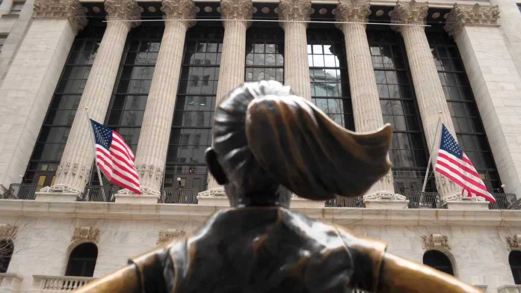 march-19-2026-new-york-united-states-the-fearless-girl-statue-is-seen-in-front-of-the-new-york-stock.webp