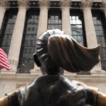 march-19-2026-new-york-united-states-the-fearless-girl-statue-is-seen-in-front-of-the-new-york-stock.webp
