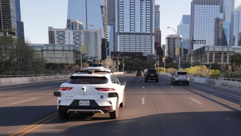 march-20-2026-austin-tx-usa-a-a-driverless-waymo-taxi-heads-s-s-over-the-first-street-bridge-in-down.webp